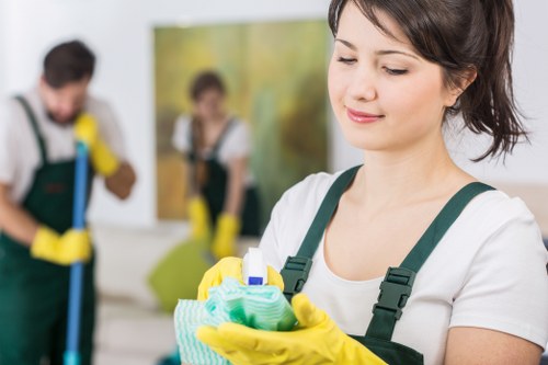 Staff member using protective equipment while cleaning carpets
