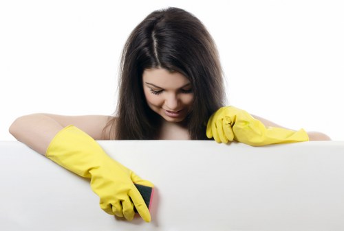 Cleaning technician applying treatment during a carpet cleaning service